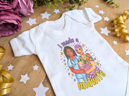 White baby vest with 'I made a midwife' colorful print, short sleeves and snap bottom