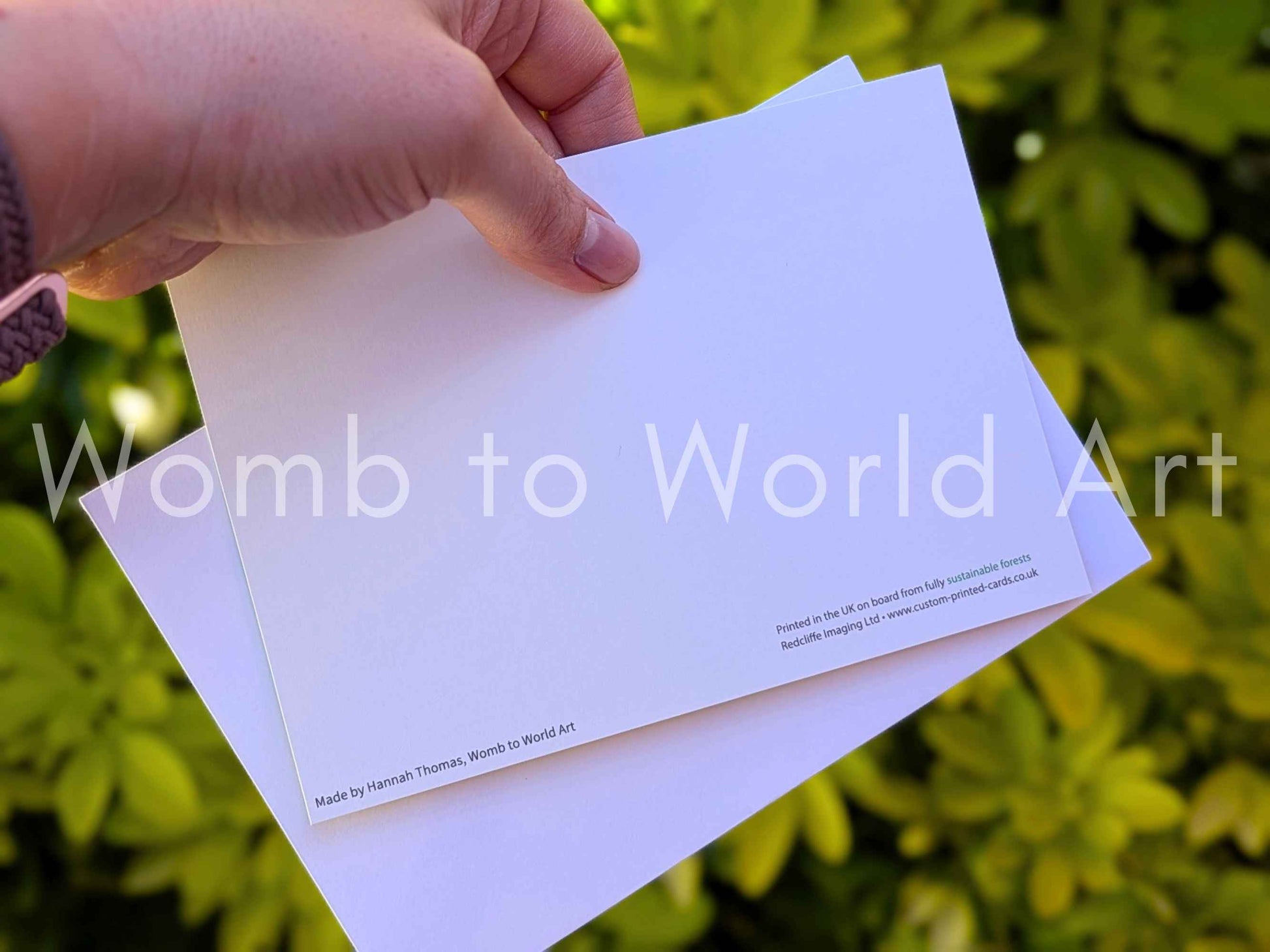 White greeting card back with small printed text near the bottom