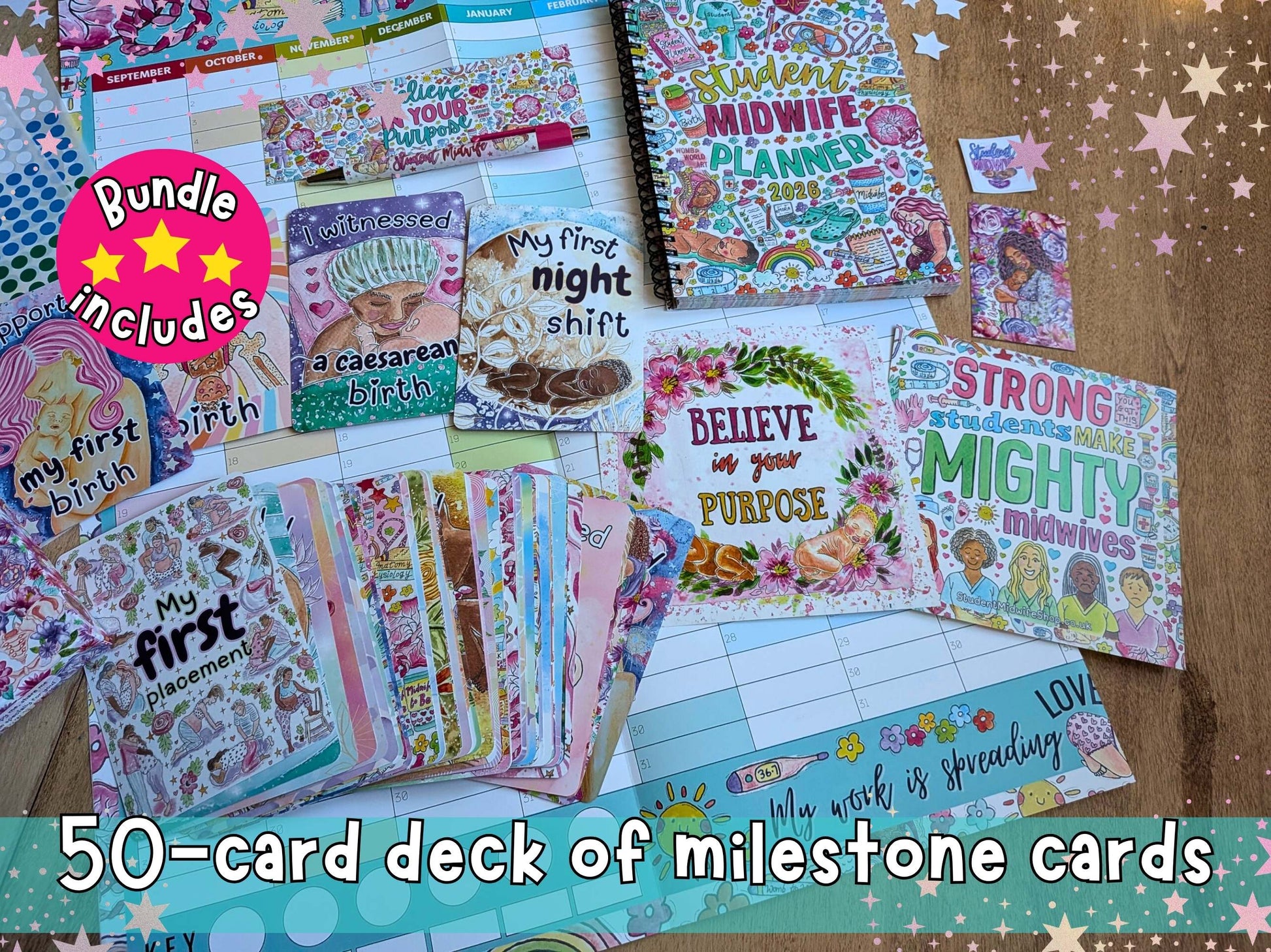 Collection of milestone cards with various designs and text on a wooden surface.