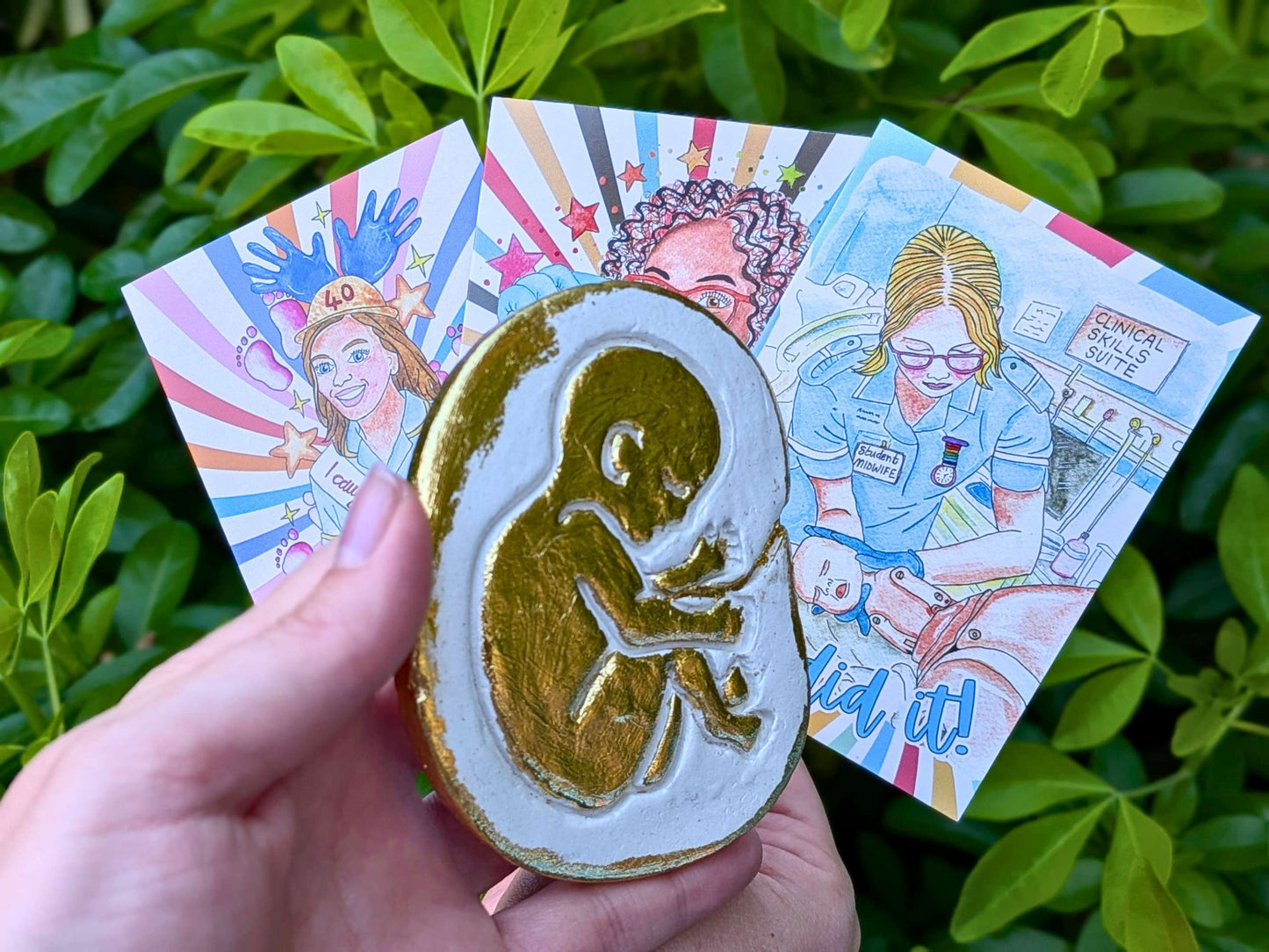 Golden baby in the womb fridge magnet
