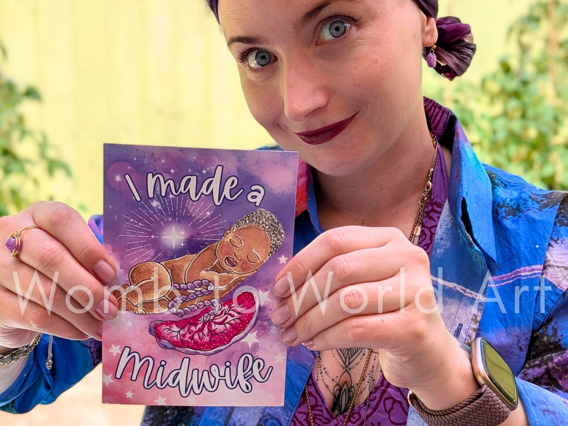 Handmade purple greeting card reading “I made a Midwife” with star rays and baby illustration